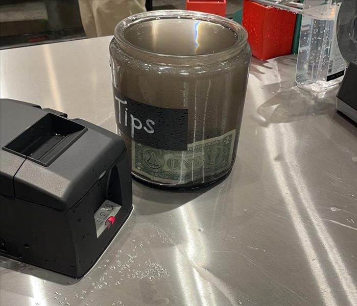 tip jar filled with gross water